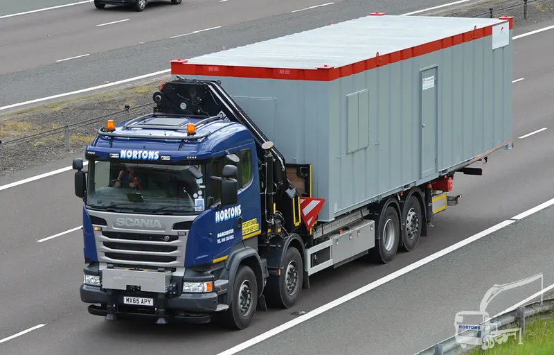 Hiab hire Scotland - hiab lorry hauling a cabin on the M74 into Scotland