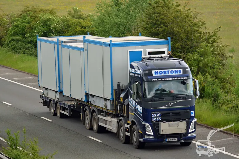 Hiab lorry transporting a cabin on the motorway towards Scotland