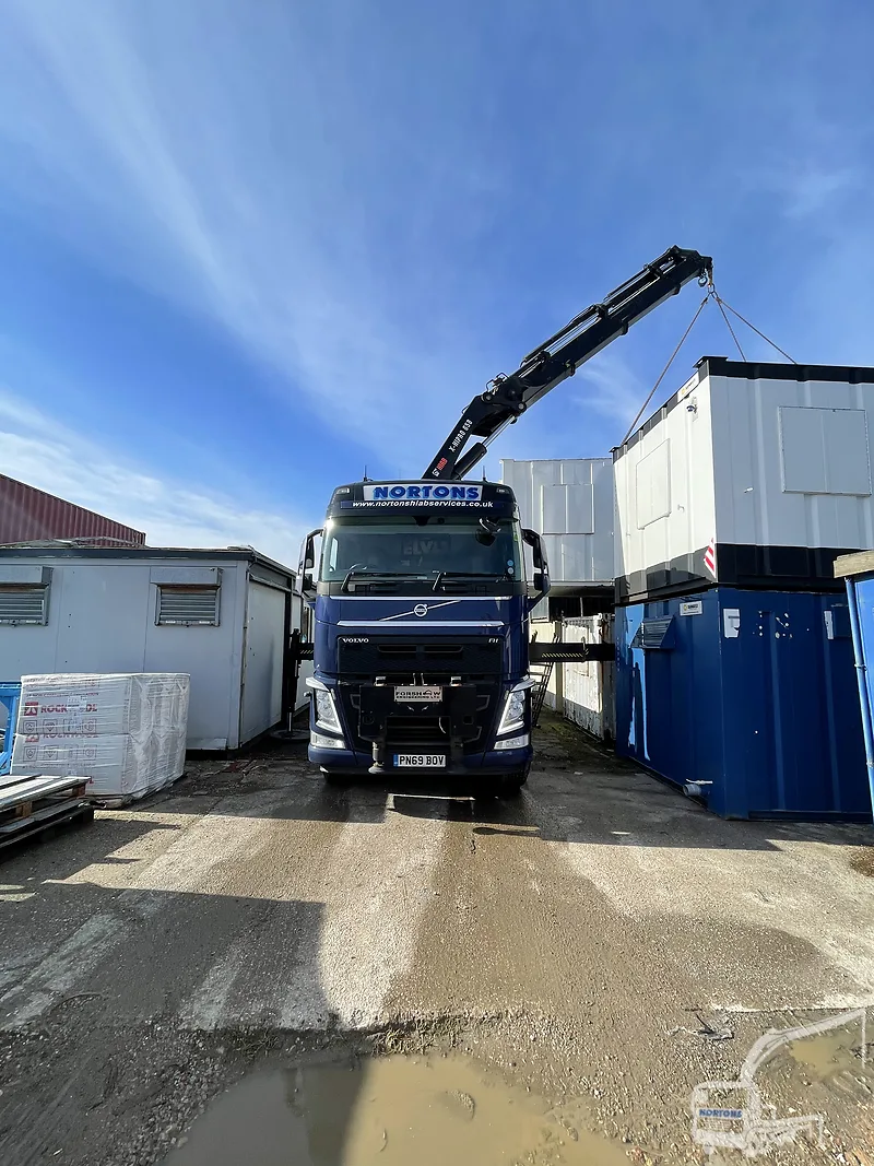 Hiab lorry lifting a cabin into a car park near Bristol