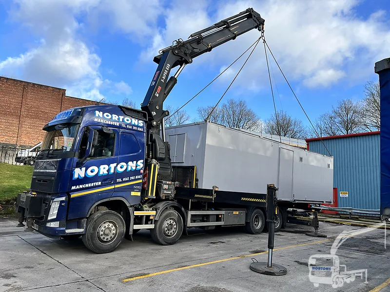 Hiab hire Newcastle - hiab lorry lifting a cabin in a North East industrial yard