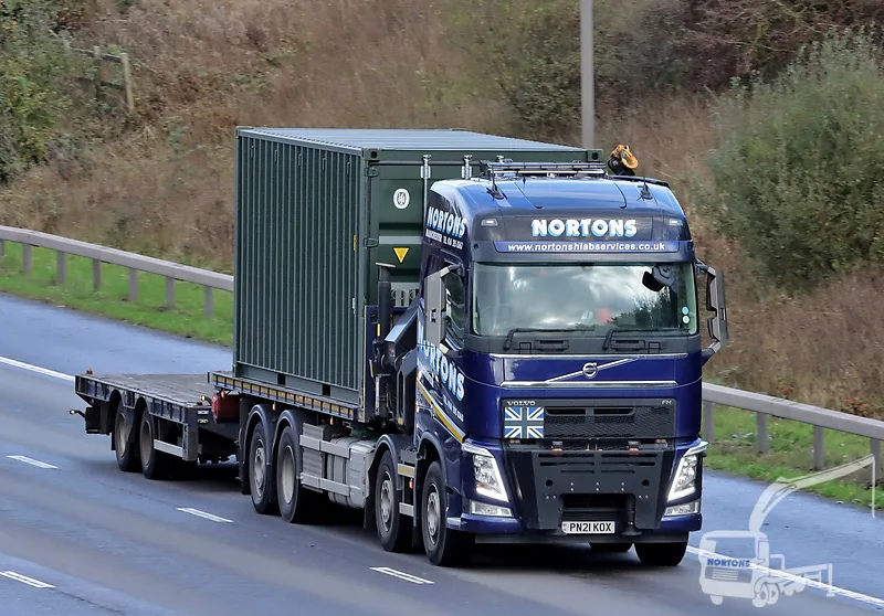 Hiab lorry hauling a container from Hull port along the motorway network