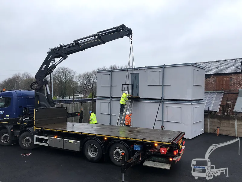 Hiab lorry with modular building panels on a Nottingham site