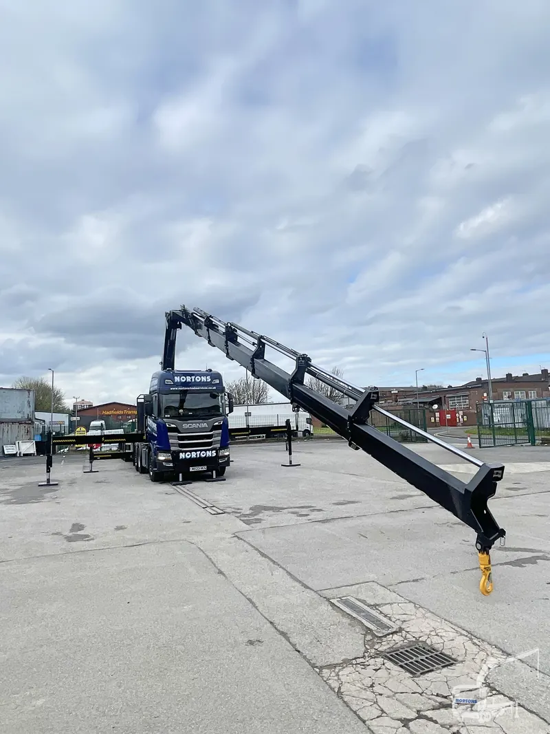 Hiab lorry hire - crane boom fully extended at the depot