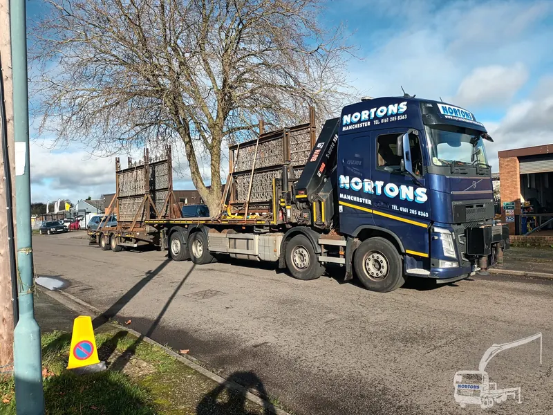 Hiab lorry loaded with timber for a winter site delivery