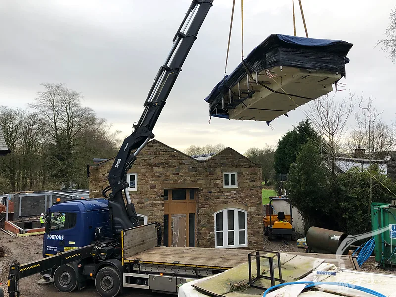 Hiab hire Preston - hiab lorry lifting a load onto a Lancashire site