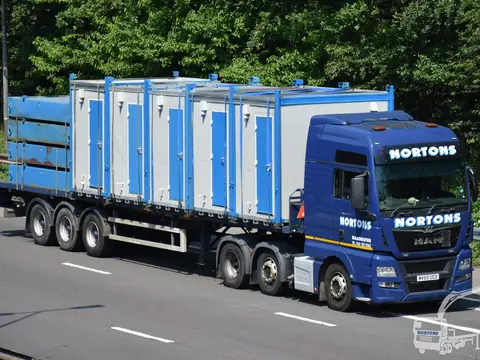 Double cabin load on a flatbed trailer on the motorway
