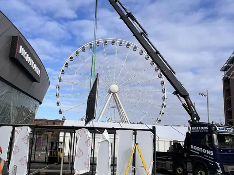 Event logistics with the big wheel behind the hiab lorry