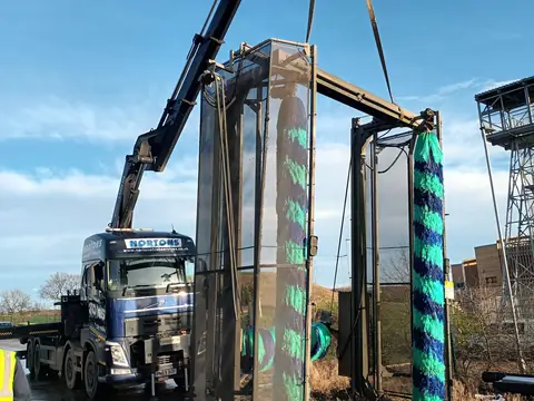 Precision hiab lift of illuminated panels