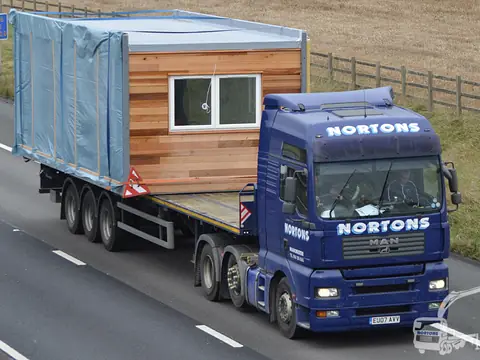 Timber clad lodge transported along the M6